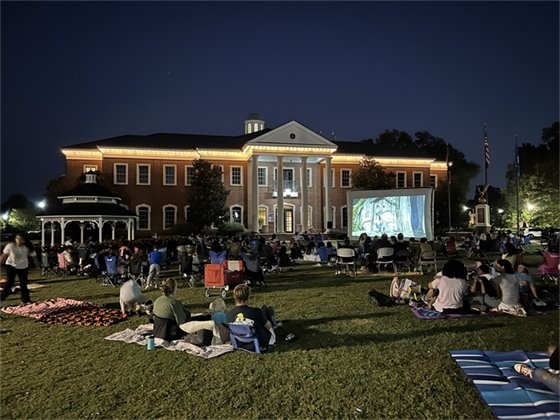 Folks gather on the front lawn during our Fall Movie Series in front of City hall