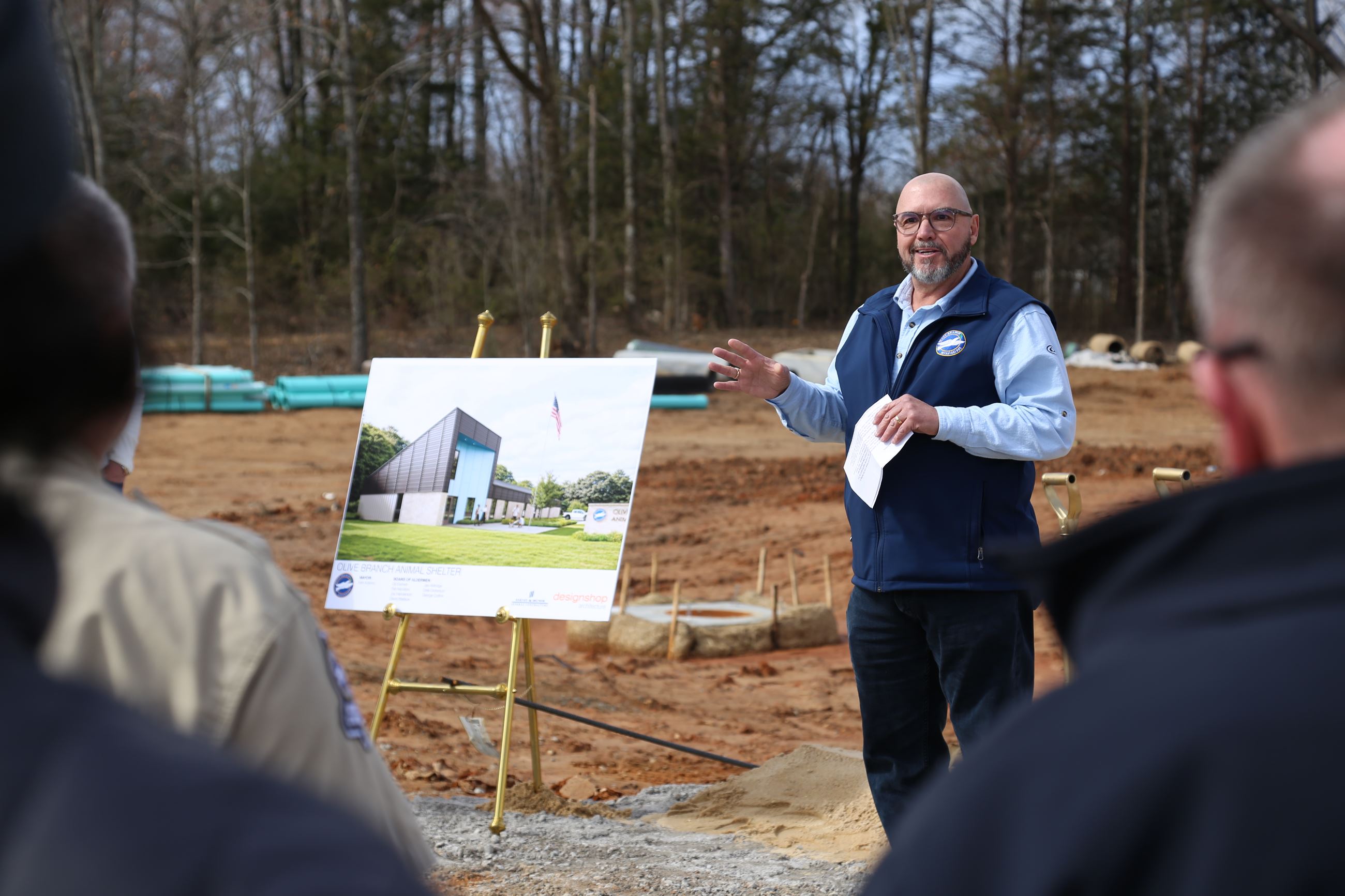 Photo Release Mayor Adams greets crowd beside a depiction of the new animal shelter