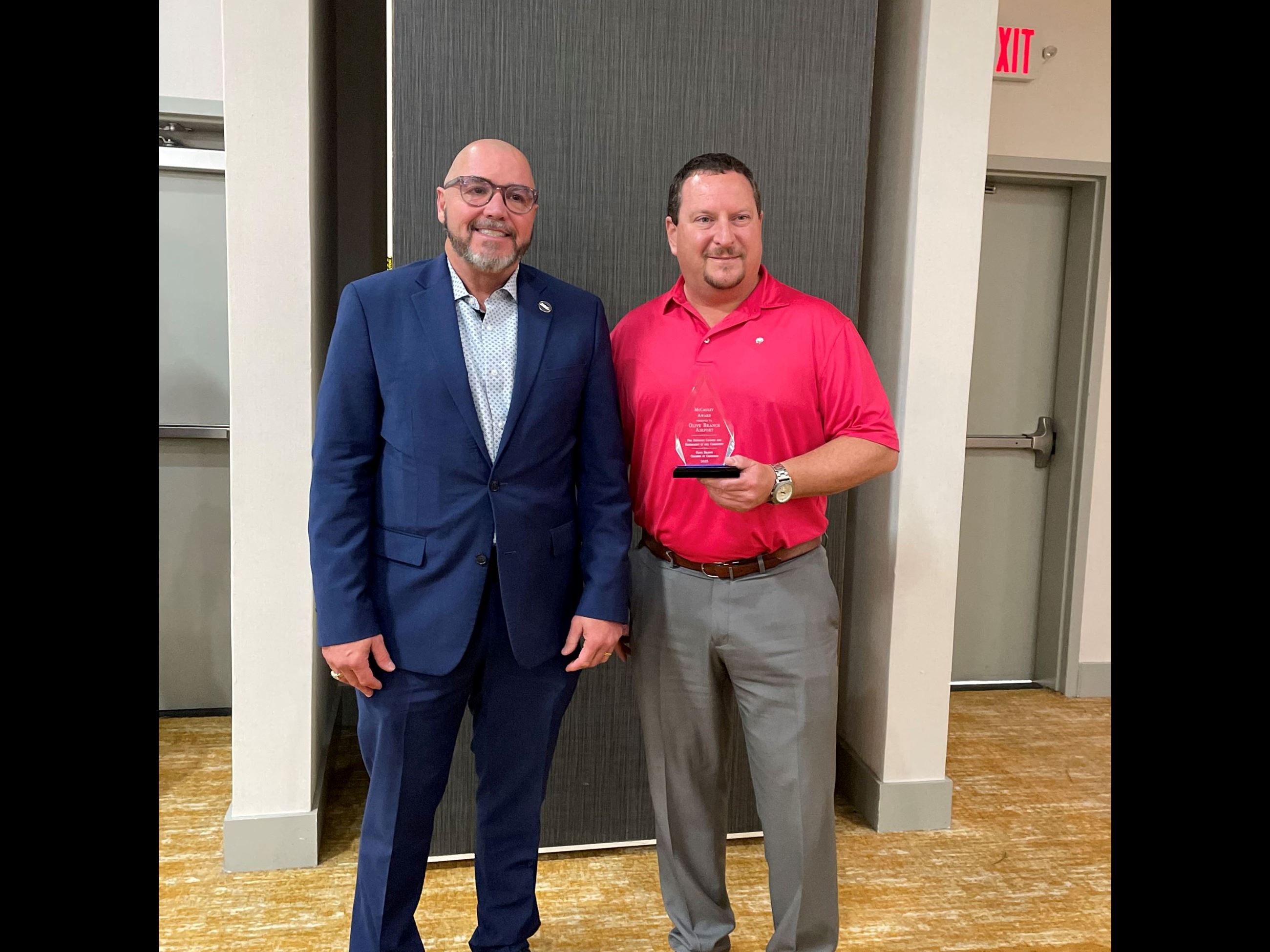Mayor Ken Adams  and Director David Taylor accept the McCauley award