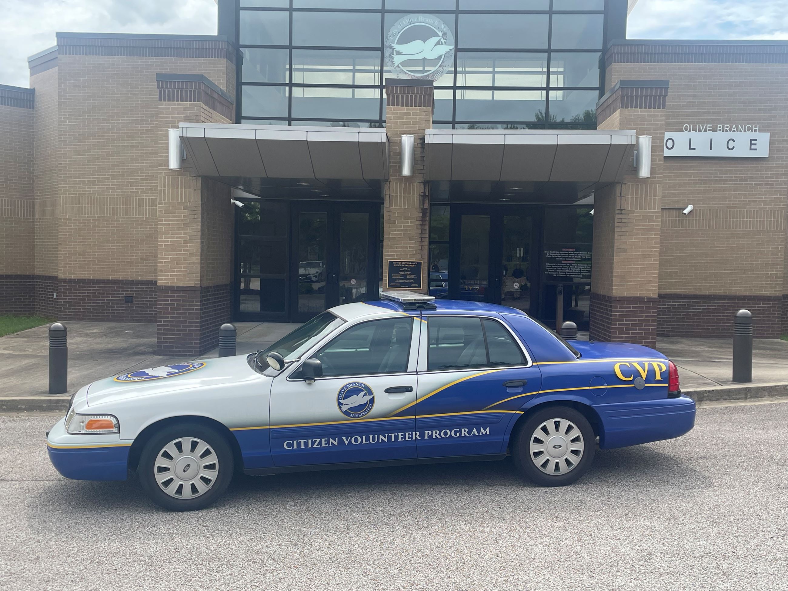 Citizen Volunteer Program Car parked in front of the Olive Branch Police Department