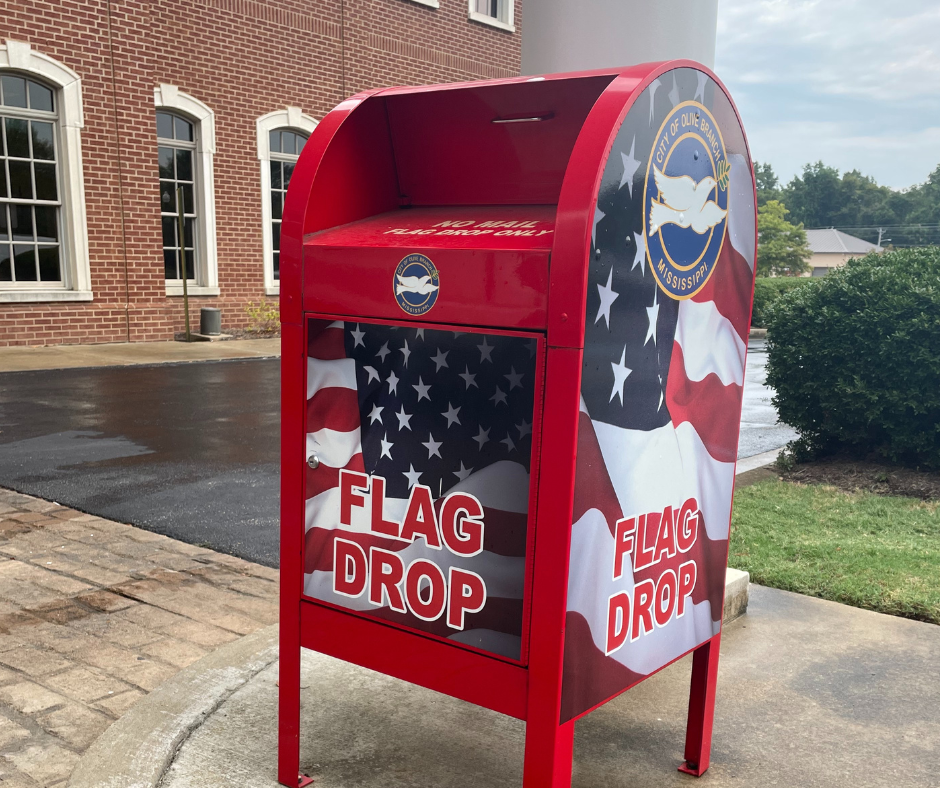 A repurposed mail box has been adopted for collection of retired or torn American Flags